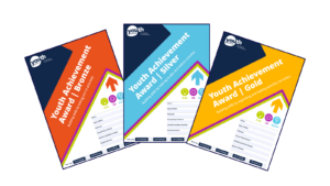 The covers for the Bronze, Silver and Gold Youth Achievement Award booklets are arranged from left to right.