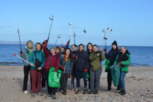 Group image from the Rural Youth Action Network and Ariane Burgess MSP at a beach clean.